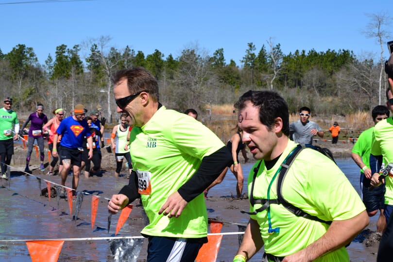 two men running at Tough Mudder