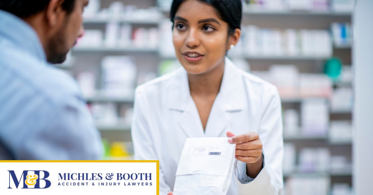 Pharmacist handing prescription to patient