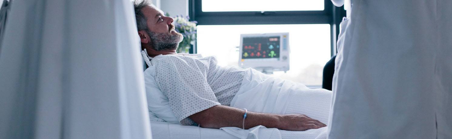 Image of man in hospital bed